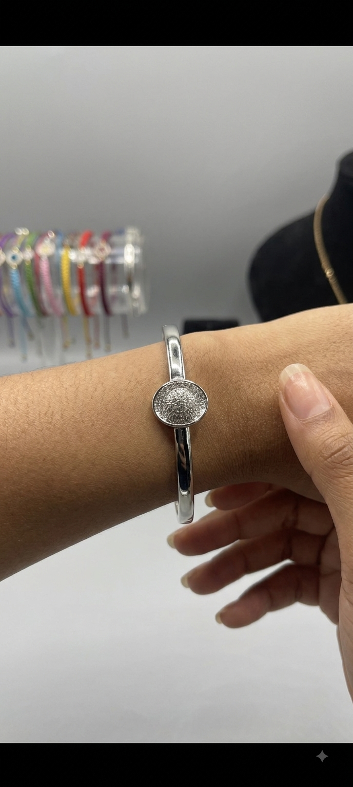 Embossed Medallion Silver Bangle