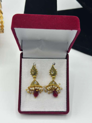 The Crimson Pearl Jhumkas: Antique Gold with Ruby-Glass Drops