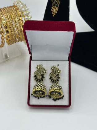 Antique Gold-Plated Peacock Jhumka Earrings with Ruby Red Accents